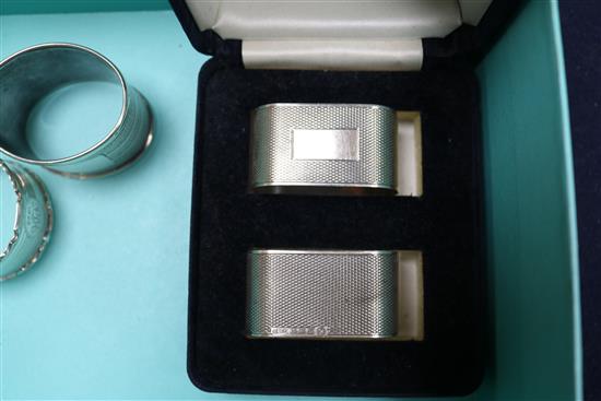 A cased set of six late Victorian silver napkin rings, Birmingham, 1897, a later pair and two other napkin rings.